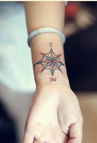 Fashionable female wrist beautiful looking compass tattoo picture