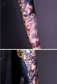Creative flower arm crow with dry twig tattoo picture