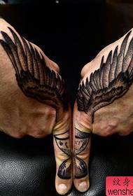Hand wings tattoo work