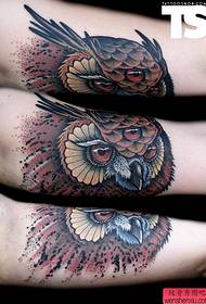 Hand owl tattoo work