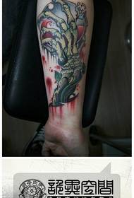 Arm of a cool classic skeleton hand tattoo pattern