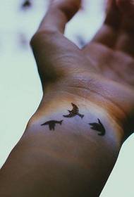 Small fresh wrist tattoo of the literary fan
