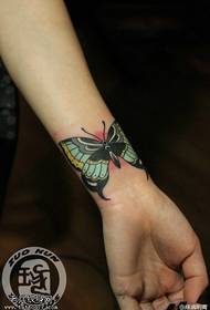 Female wrist color butterfly tattoo pattern provided by tattoo