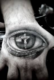 The back of the hand reflects the tattoo of Jesus on the cross