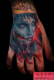 a bloody portrait tattoo on the back of the hand