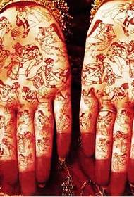 Hand full of Buddha statue religious tattoo pictures