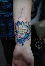 Woman wrist color lotus tattoo work