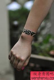 a wrist totem tattoo pattern