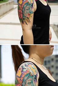 Beauty girl thinking ancient flower arm personality tattoo picture