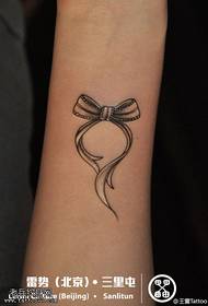 Hand small fresh bow tattoo work