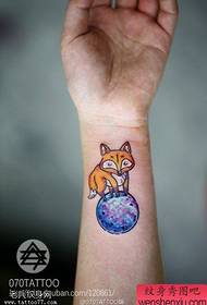 Woman wrist color starry fox tattoo work
