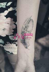 Ink, small feather, fresh tattoo picture