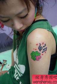 Beauty arm, four-leaf clover, tattoo