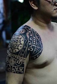 Handsome masculine half-Mayan tattoo