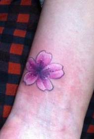 Girl's arm small and delicate cherry blossom tattoo pattern