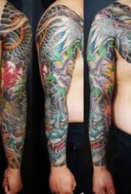 Old traditional style colored half-breasted arm tattoo