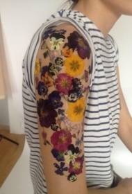 Male shoulder colorful flower tattoo pattern