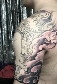 Tattoo-tatoeëring vir halfarm gekombineer met inkvis en Boeddha
