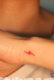 Girl's little arm, a small colored lightning tattoo pattern