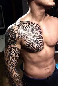 Handsome boy right hand half-tribe totem tattoo picture