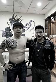 Strong men's black and white half armor tattoo pictures are very powerful