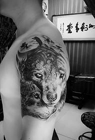 Two lion head flower arm tattoos