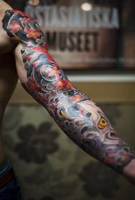 loved flower arm tattoo