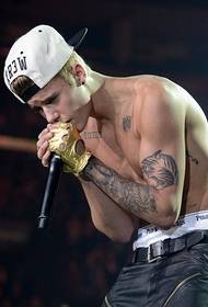 90 after the singer Justin Bieber flower arm tattoo