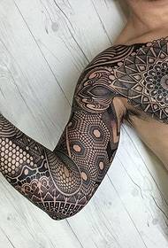 Large area black geometric full arm tattoo pattern