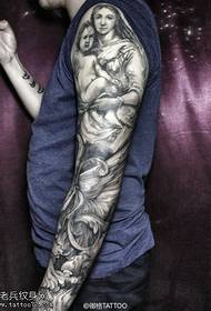 Imatge de tatuatge de braç de flor de color negre gris
