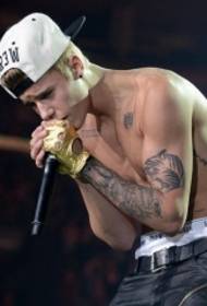 After 90 singer Justin Bieber Flower Arm Tattoo