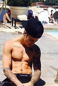 European and American sunshine handsome, Justin Bieber, flower arm tattoo