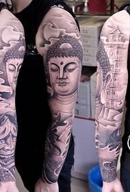 Buddha flower arm tattoo