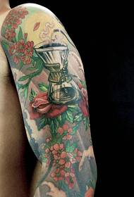 Handsome flower arm tattoo confidently full
