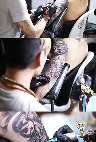 skullFlower arm tattoo scene