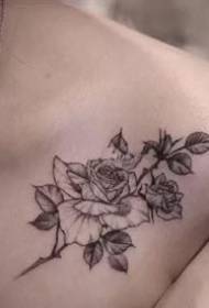 a group of beautiful small fresh tattoo designs at the girl's clavicle