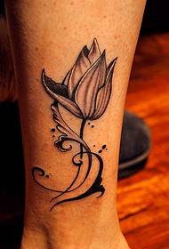 After-looking black-gray lotus tattoo picture
