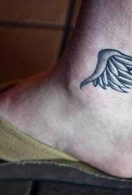 beautiful little wing tattoo at the ankle