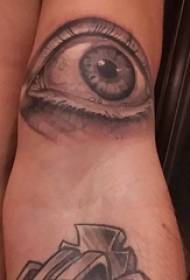 double arm tattooed male on the arm Black eye tattoo picture