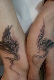 couple personality wings tattoo