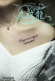 character tattoo pattern at the shoulder clavicle