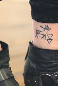 simple totem tattoo on the ankle