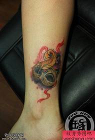 female ankle color mask tattoo pattern