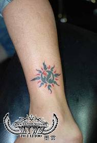 beautiful sun totem tattoo on the ankle