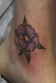 small fresh purple flower tattoo on the bare feet is particularly beautiful