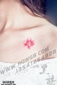peach tattoo tattoo at the clavicle