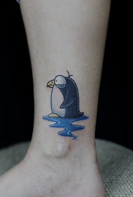 Pale penguin ankle tattoo