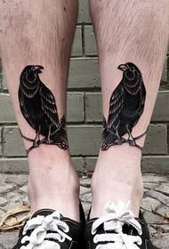 vivid bird tattoo on the ankle