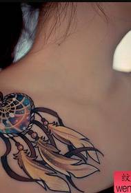 a woman's clavicle dream catcher tattoo pattern
