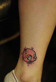 girl's legs are small and cute skull tattoo